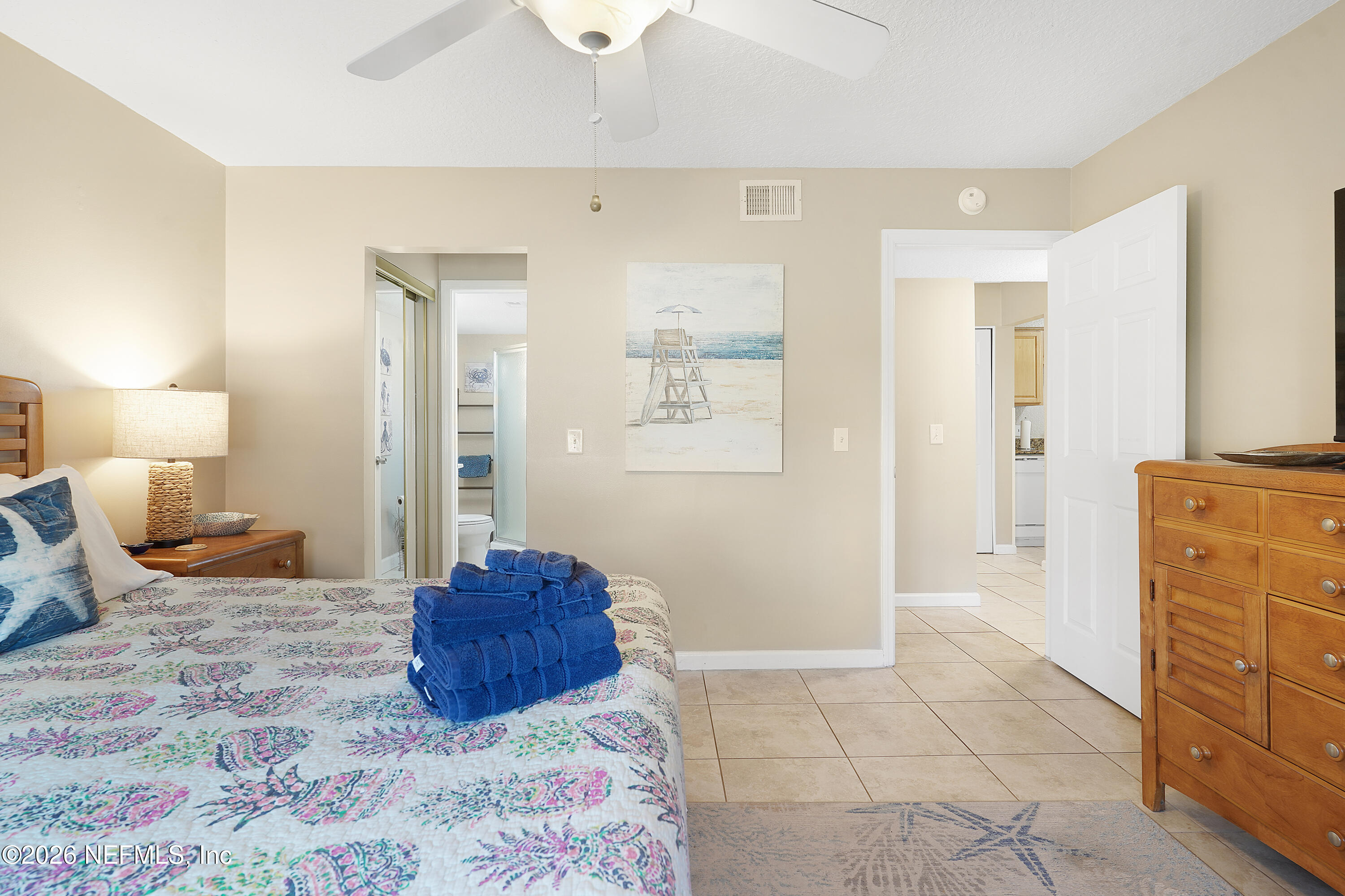 9 Clipper Court St. Augustine, FL 32080 - Photo 13 of 22 a spacious bedroom with a bed and cabinets