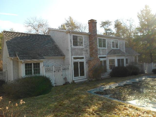 255 Little River Road Cotuit, MA 02635 - Photo 8 of 10 front view of a house with a yard