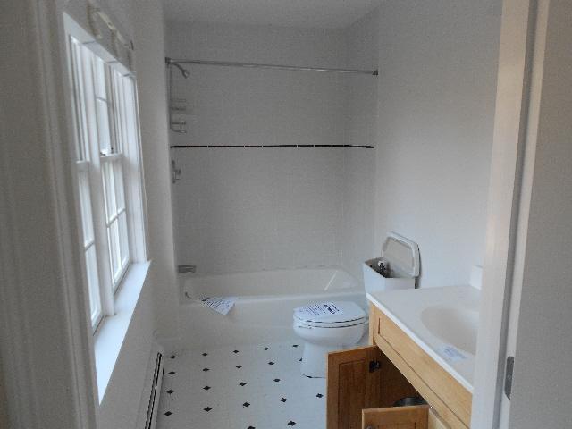 255 Little River Road Cotuit, MA 02635 - Photo 10 of 10 a bathroom with a bathtub and window