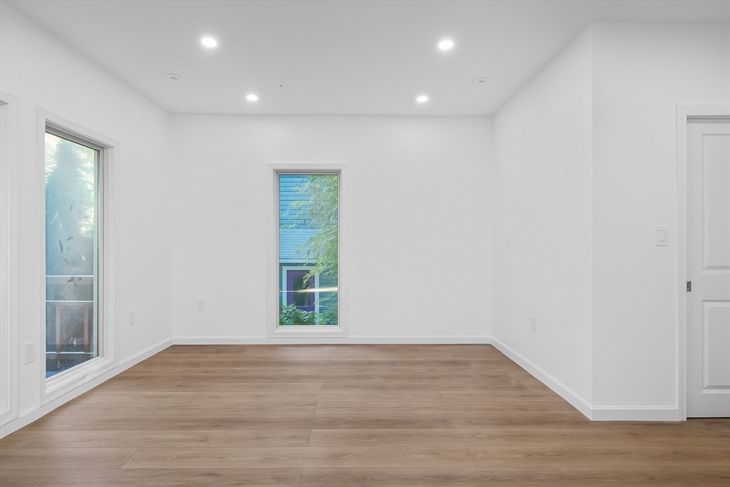 172 Lexington Avenue, Unit 1 Cambridge, MA 02138 - Photo 7 of 19 a view of empty room with wooden floor