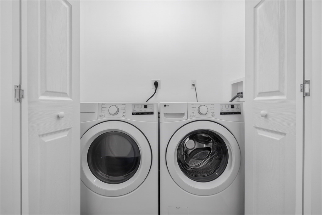 172 Lexington Avenue, Unit 1 Cambridge, MA 02138 - Photo 8 of 19 a utility room with dryer and washer
