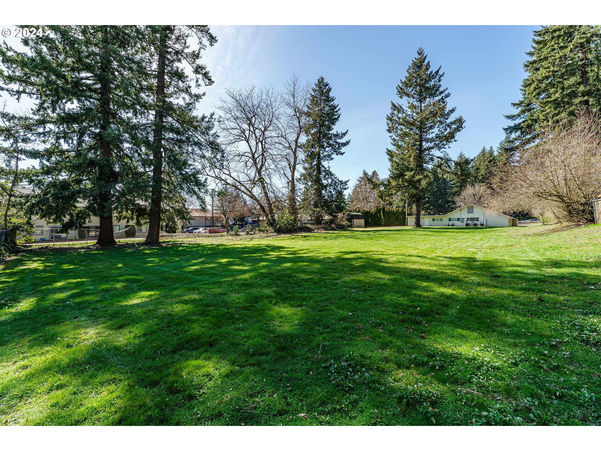 Northeast 162nd Avenue Portland, OR 97230 - Photo 5 of 15 a view of a grassy field with trees