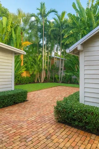 a view of a yard and front view of a house