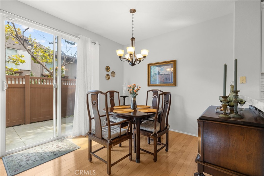 17823 Poplar Court Carson, CA 90746 - Photo 11 of 30 a dining room with furniture a chandelier and window