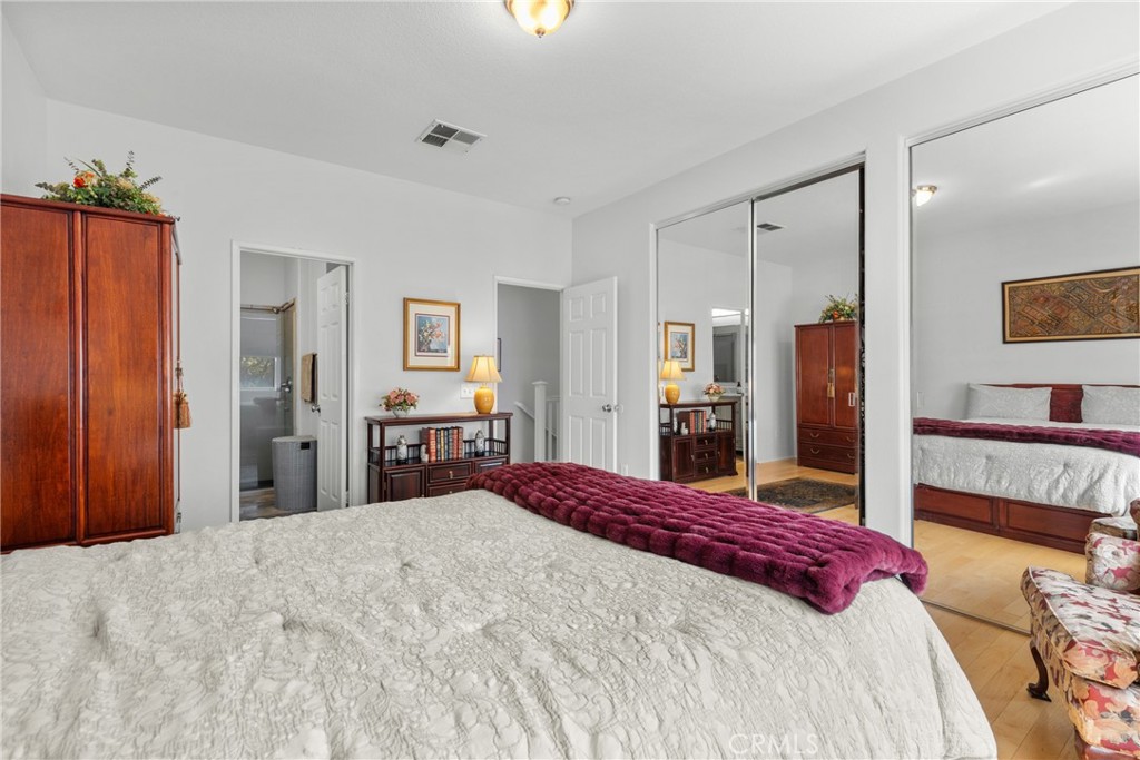 17823 Poplar Court Carson, CA 90746 - Photo 16 of 30 a bedroom with a large bed and a dresser