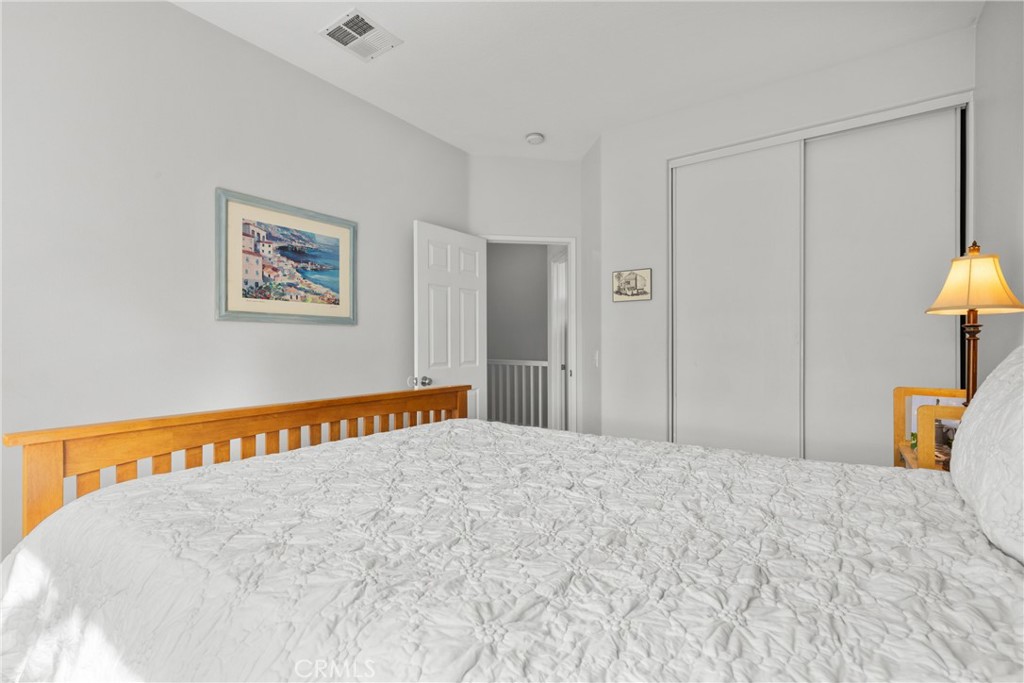 17823 Poplar Court Carson, CA 90746 - Photo 19 of 30 a bedroom with a bed and a lamp on table