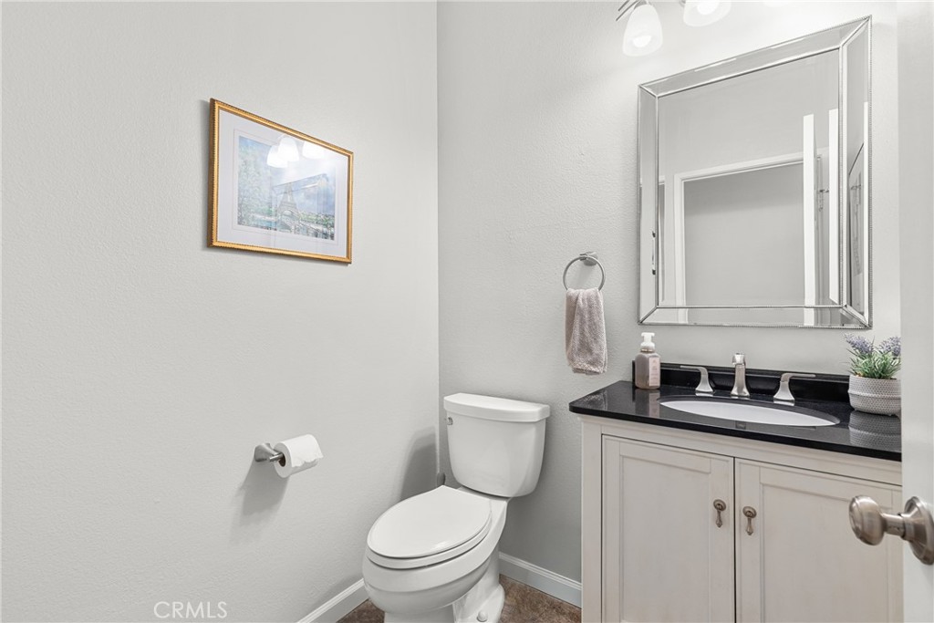 17823 Poplar Court Carson, CA 90746 - Photo 20 of 30 a bathroom with a toilet sink and mirror