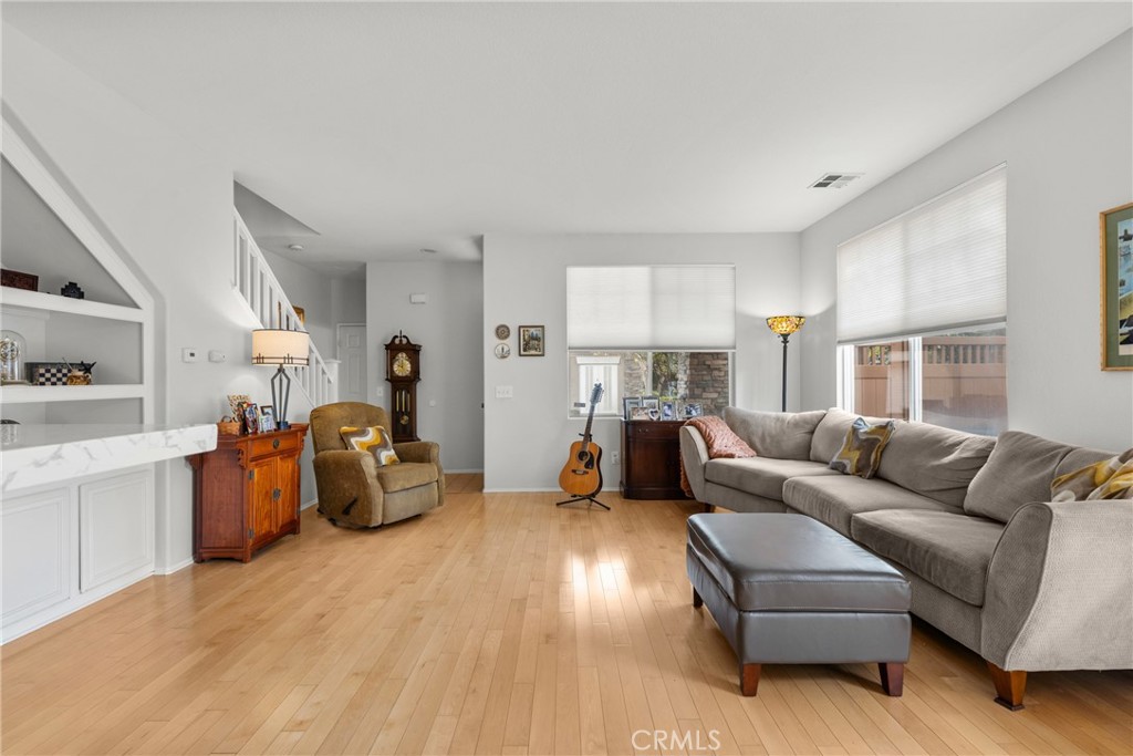 17823 Poplar Court Carson, CA 90746 - Photo 2 of 30 a living room with furniture and a wooden floor