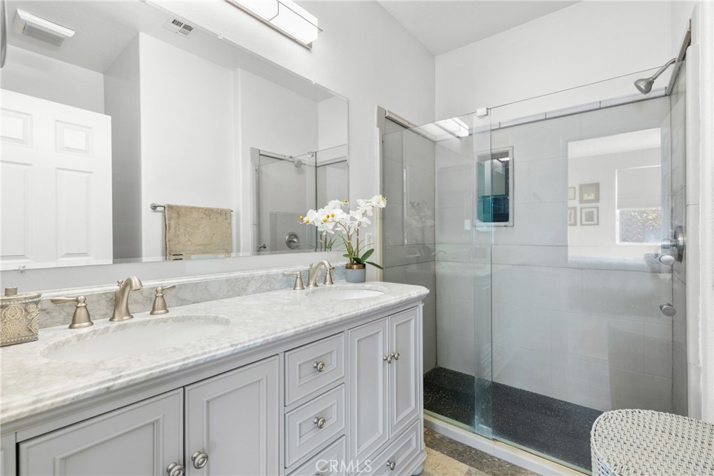 17823 Poplar Court Carson, CA 90746 - Photo 8 of 30 a bathroom with a granite countertop sink a toilet and shower