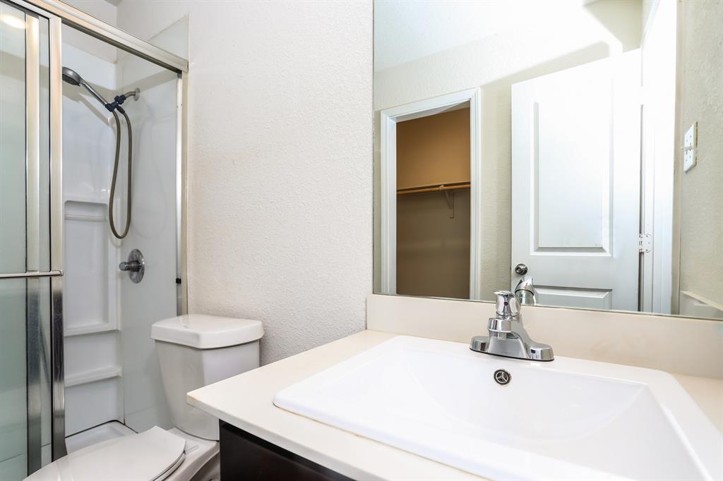 2515 Lyle Avenue Waco, TX 76708 - Photo 13 of 21 a bathroom with a sink toilet and shower