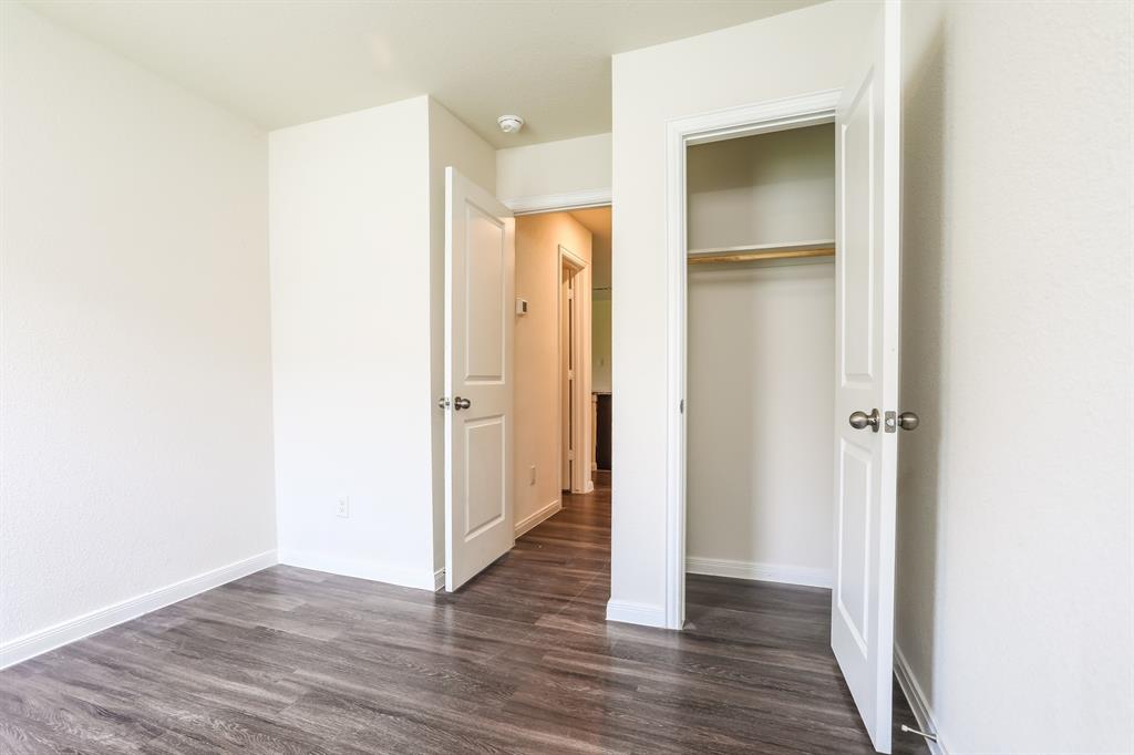 2515 Lyle Avenue Waco, TX 76708 - Photo 17 of 21 a view of a hallway with wooden floor