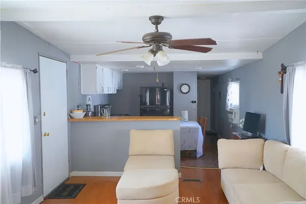 a living room with a couch and a chandelier