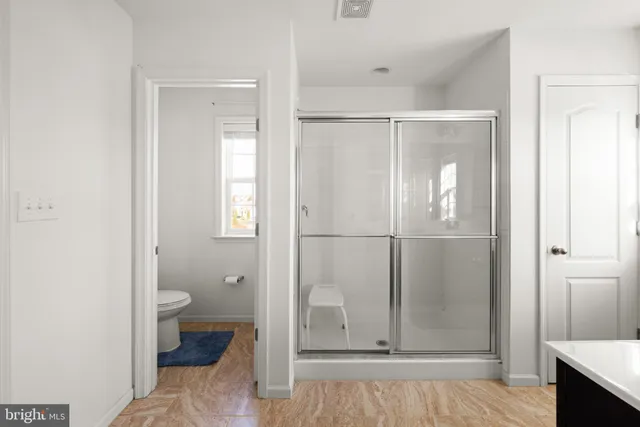 a view of a bathroom with toilet