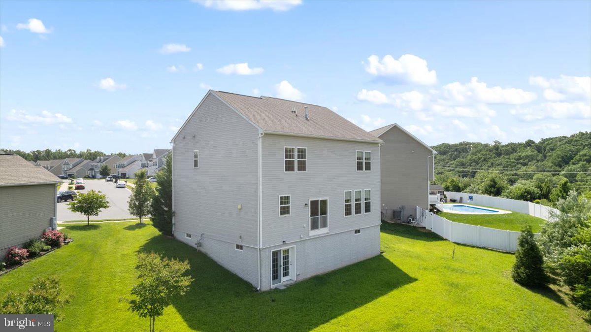 100 Taylor Court Stephenson, VA 22656 - Photo 35 of 36 a view of house with backyard space and swimming pool