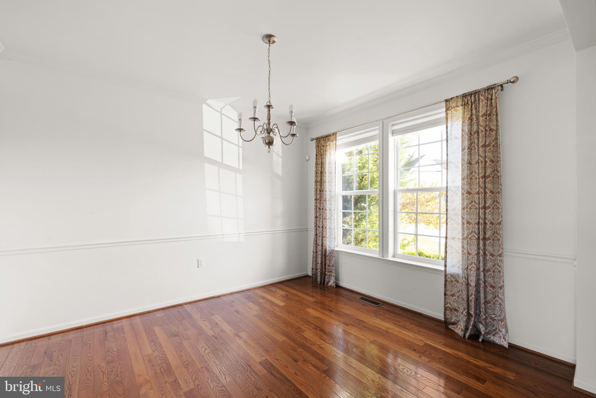 100 Taylor Court Stephenson, VA 22656 - Photo 9 of 36 a view of an empty room with wooden floor and a window