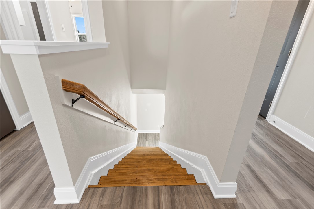 11001-11005 Breedlove Road College Station, TX 77845 - Photo 16 of 40 Stairs featuring wood finished floors and baseboards