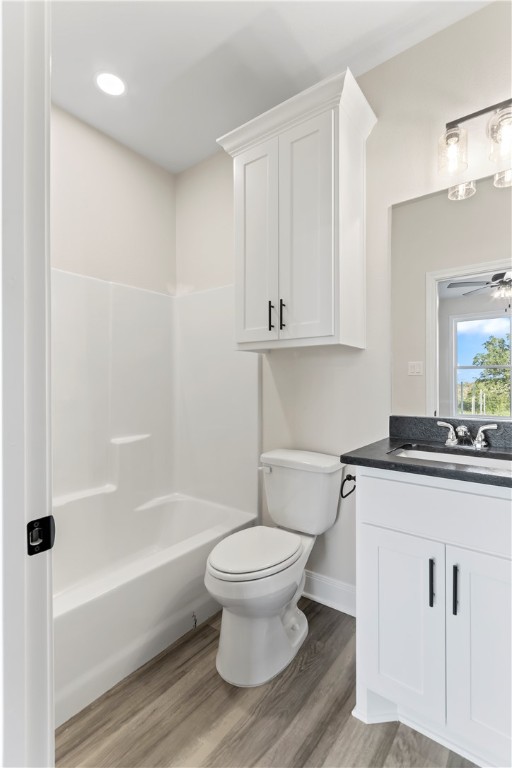 11001-11005 Breedlove Road College Station, TX 77845 - Photo 25 of 40 Bathroom with vanity, light wood-type flooring, ceiling fan, shower / bath combination, and recessed lighting