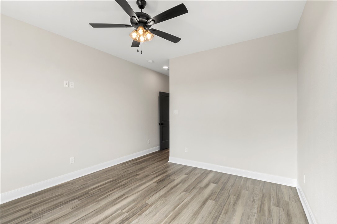 11001-11005 Breedlove Road College Station, TX 77845 - Photo 29 of 40 Spare room with light wood-type flooring and ceiling fan