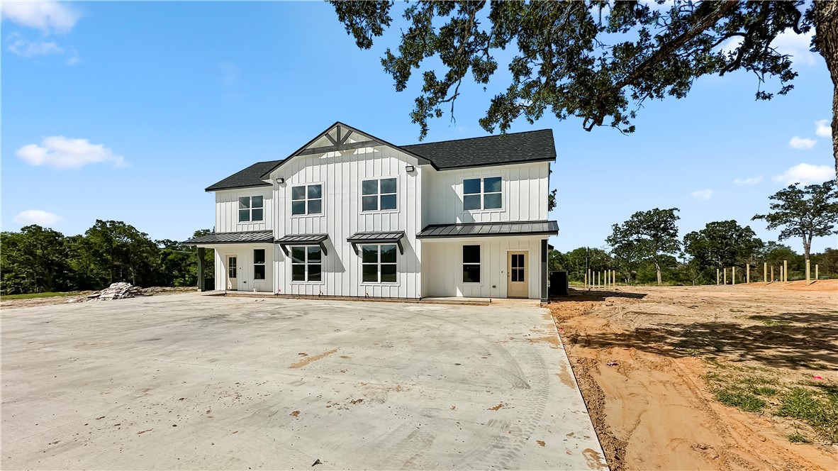 11001-11005 Breedlove Road College Station, TX 77845 - Photo 3 of 40 Modern farmhouse style home with a standing seam roof, a metal roof, covered porch, and roof with shingles