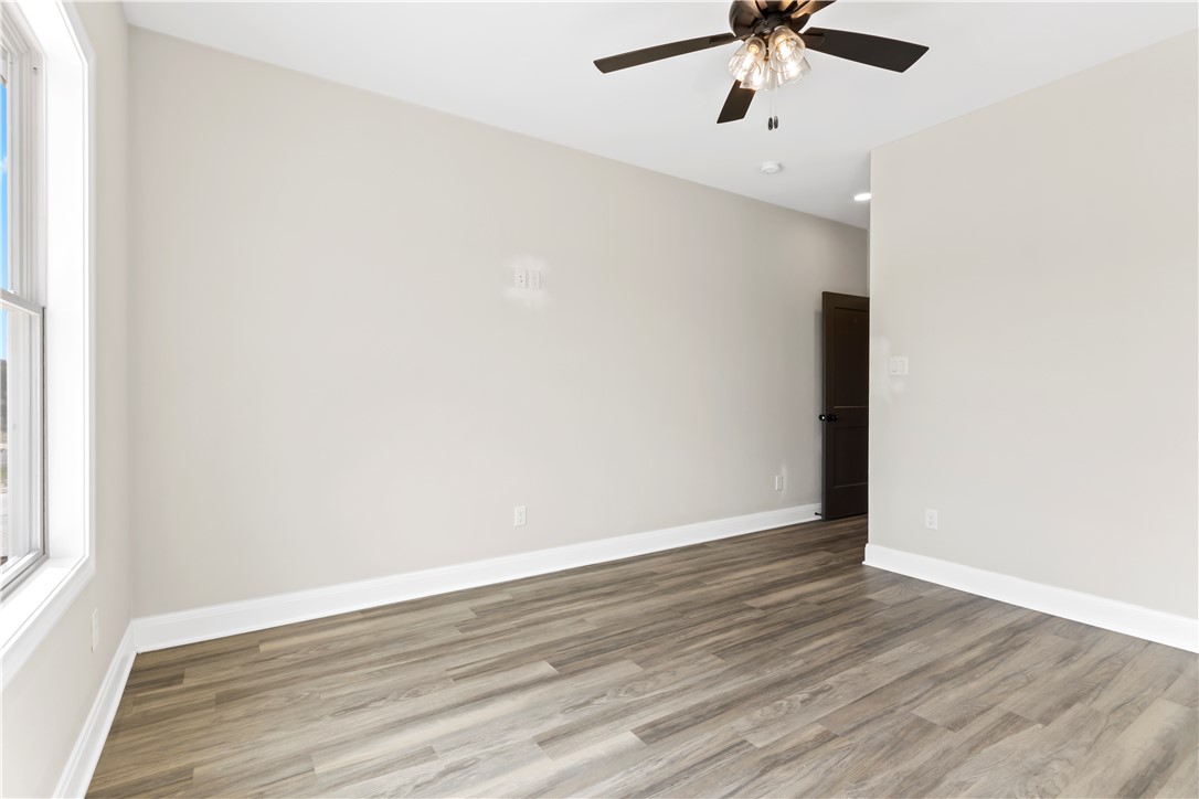 11001-11005 Breedlove Road College Station, TX 77845 - Photo 39 of 40 Spare room with wood finished floors and ceiling fan