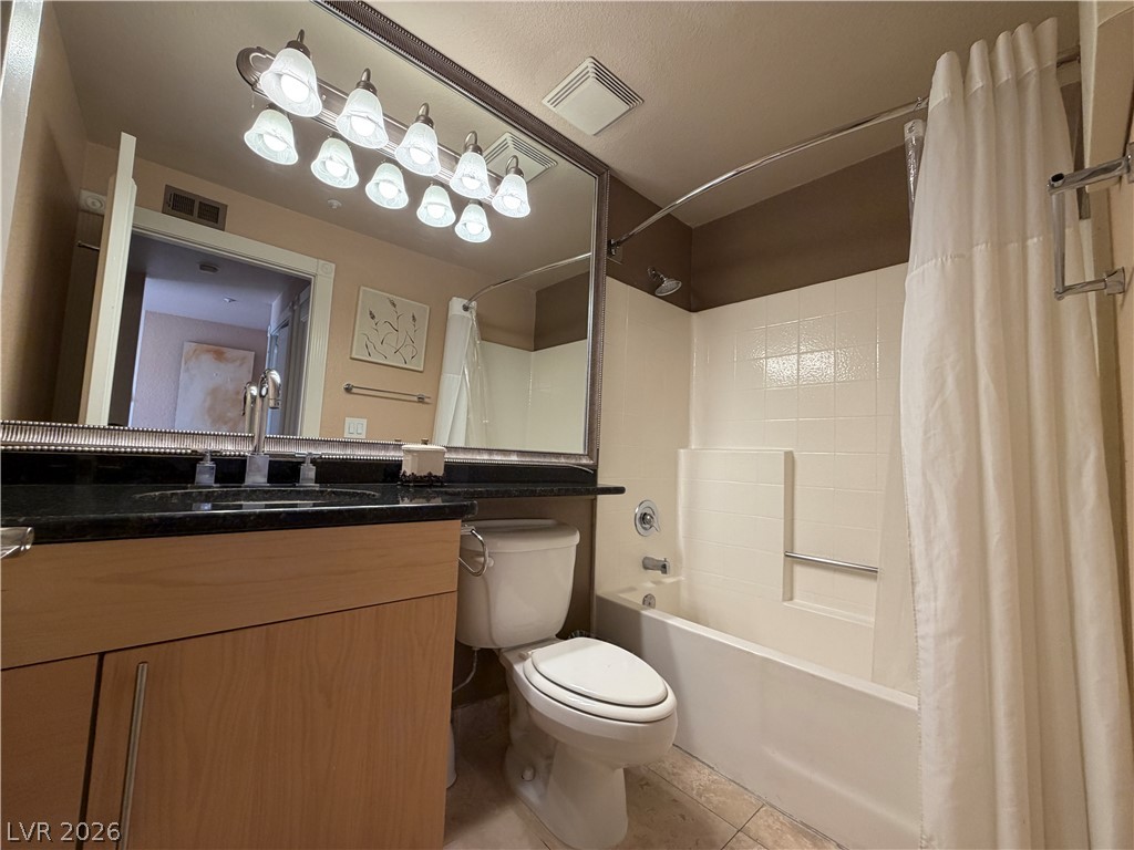 210 East Flamingo Road, Unit 426 Las Vegas, NV 89169 - Photo 17 of 17 A functional primary bathroom offers a convenient shower-tub combination and dark granite counters.