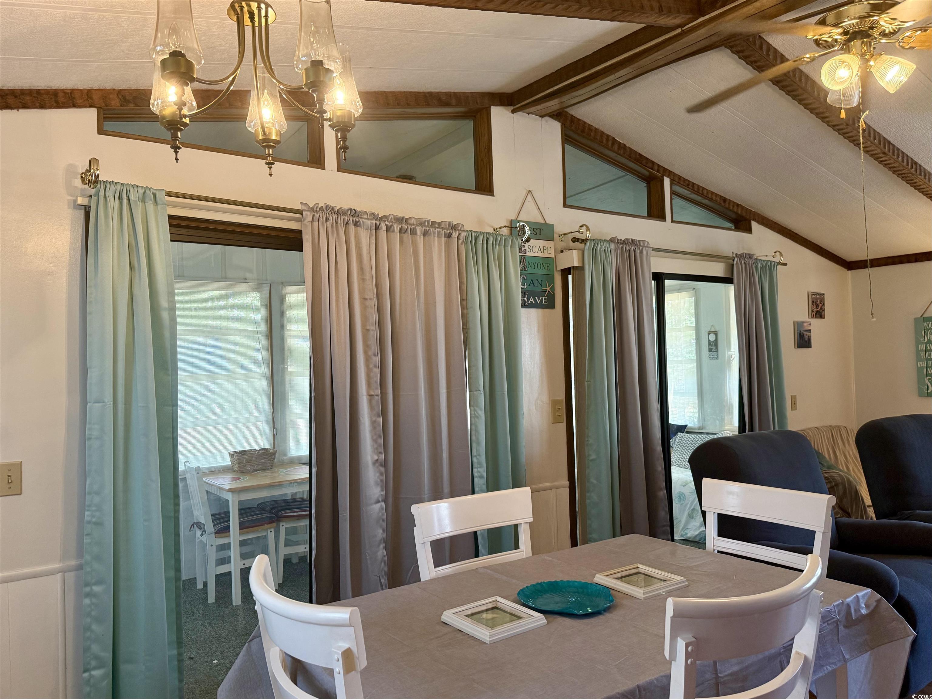 410 E Lake Surfside Beach, SC 29575 - Photo 4 of 27 Dining space with a ceiling fan