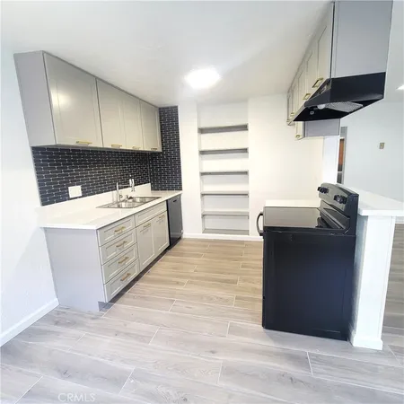 a room with a cabinets and wooden floor