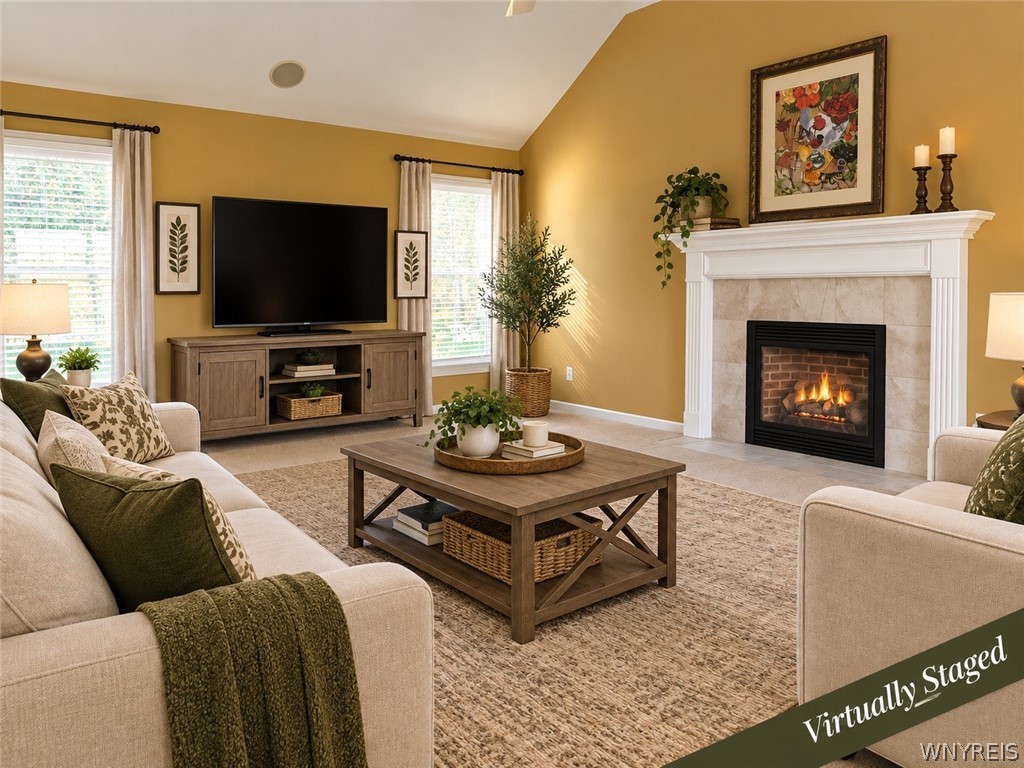 73 Chestnut Lancaster, NY 14086 - Photo 6 of 41 Vaulted ceilings and a tiled fireplace mantle anchor this comfortable living area. Virtually Staged