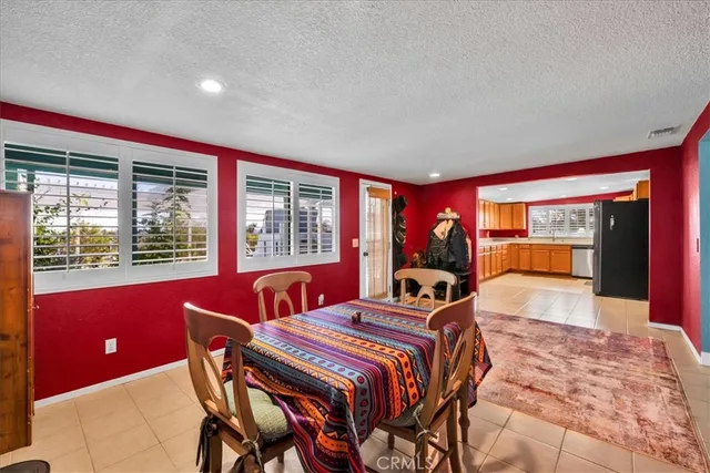 a bedroom with bed and a lamp