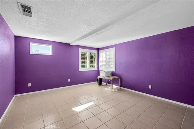 a bedroom with a bed and a yard