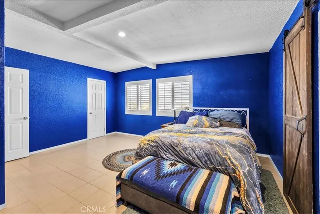 a kitchen with a refrigerator and a sink