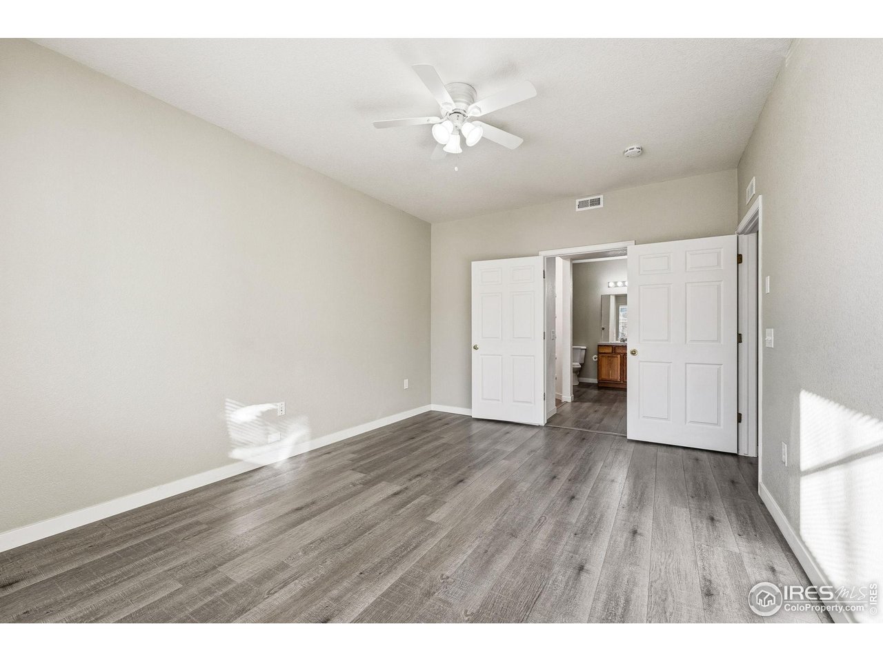 4501 Nelson Road, Unit 2404 Longmont, CO 80503 - Photo 14 of 23 a view of an empty room and wooden floor