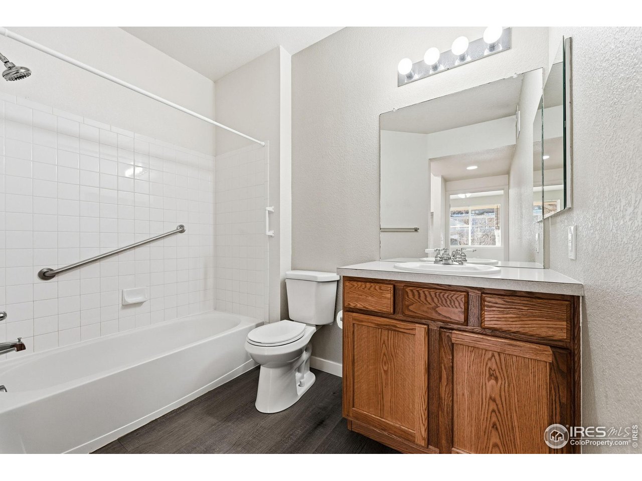 4501 Nelson Road, Unit 2404 Longmont, CO 80503 - Photo 16 of 23 a bathroom with a sink a toilet and shower