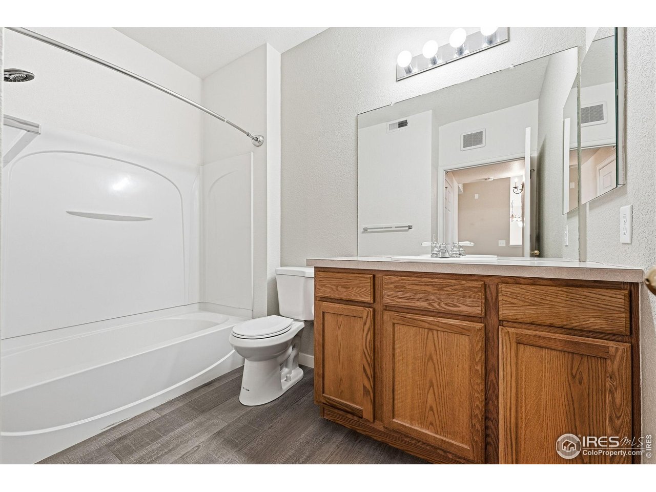 4501 Nelson Road, Unit 2404 Longmont, CO 80503 - Photo 19 of 23 a bathroom with a sink a toilet and shower