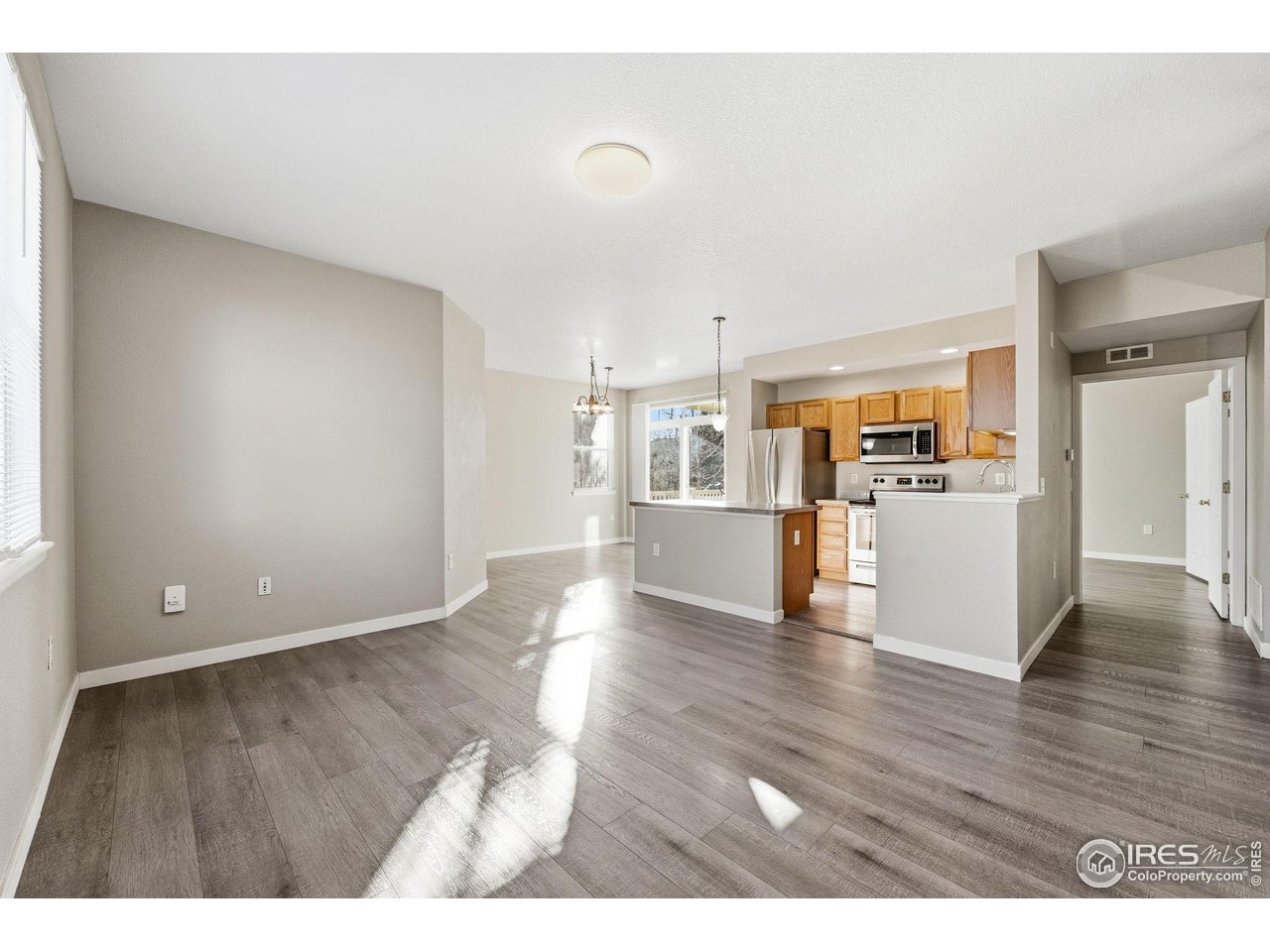 4501 Nelson Road, Unit 2404 Longmont, CO 80503 - Photo 2 of 23 a view of a kitchen with wooden floor