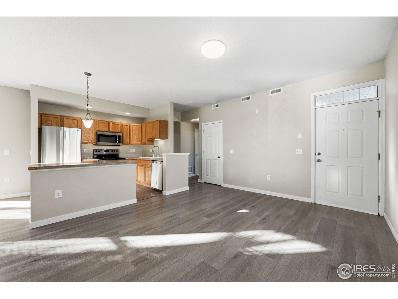 4501 Nelson Road, Unit 2404 Longmont, CO 80503 - Photo 3 of 23 a view of kitchen with refrigerator and window