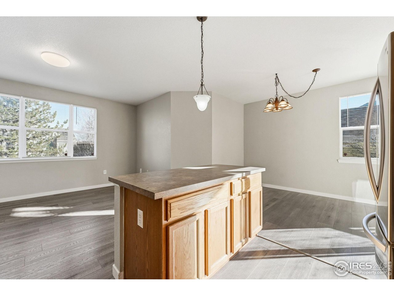 4501 Nelson Road, Unit 2404 Longmont, CO 80503 - Photo 9 of 23 a kitchen that has a lot of cabinets and wooden floor
