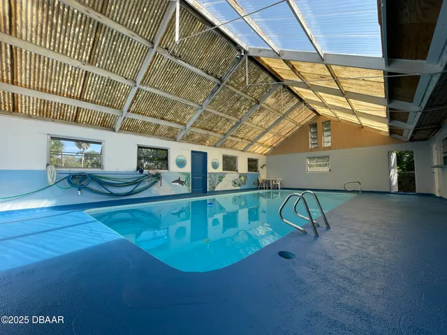 a view of a swimming pool with a patio