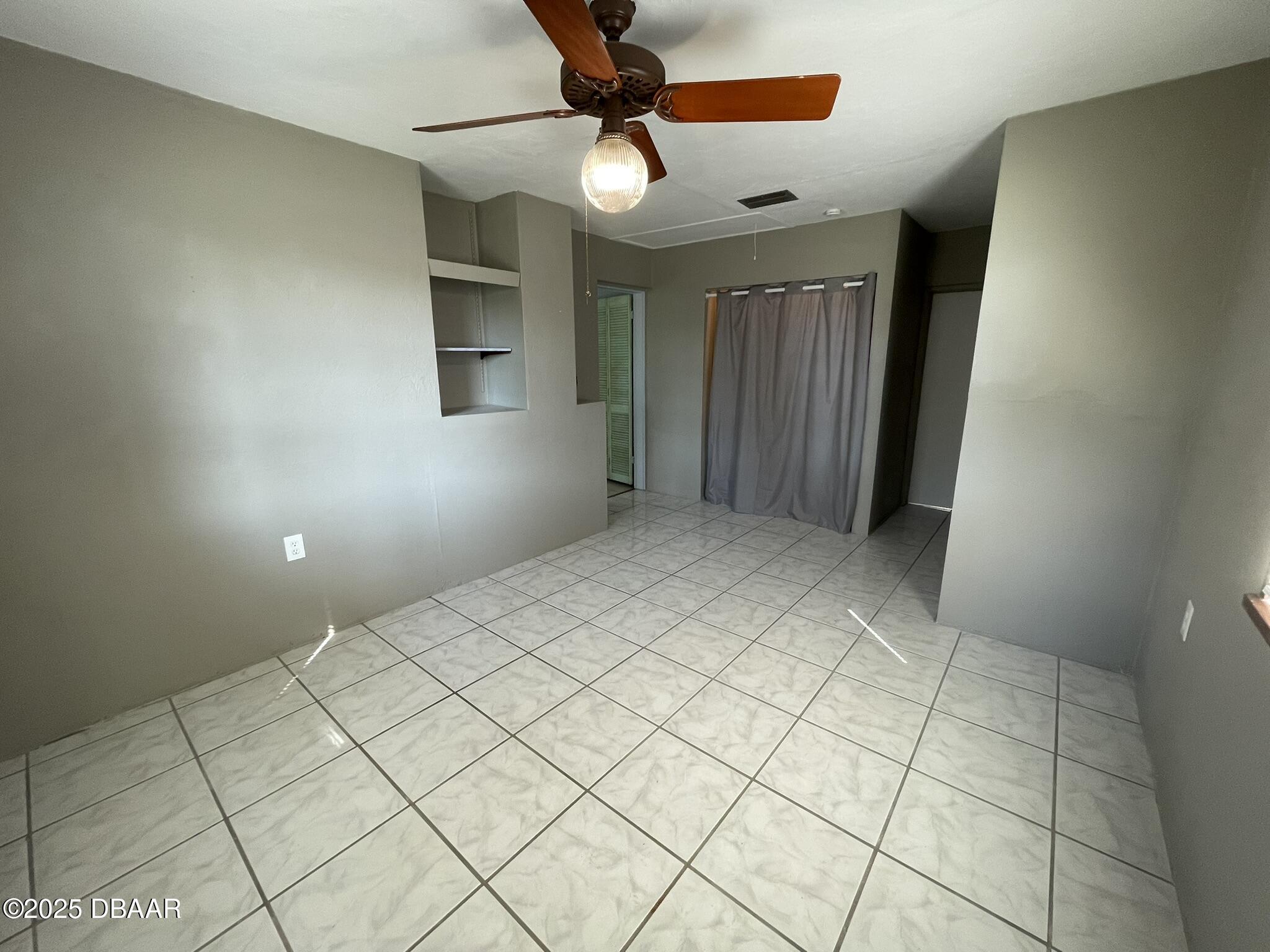 113 Fox Place Port Orange, FL 32127 - Photo 15 of 40 a view of an empty room and a window