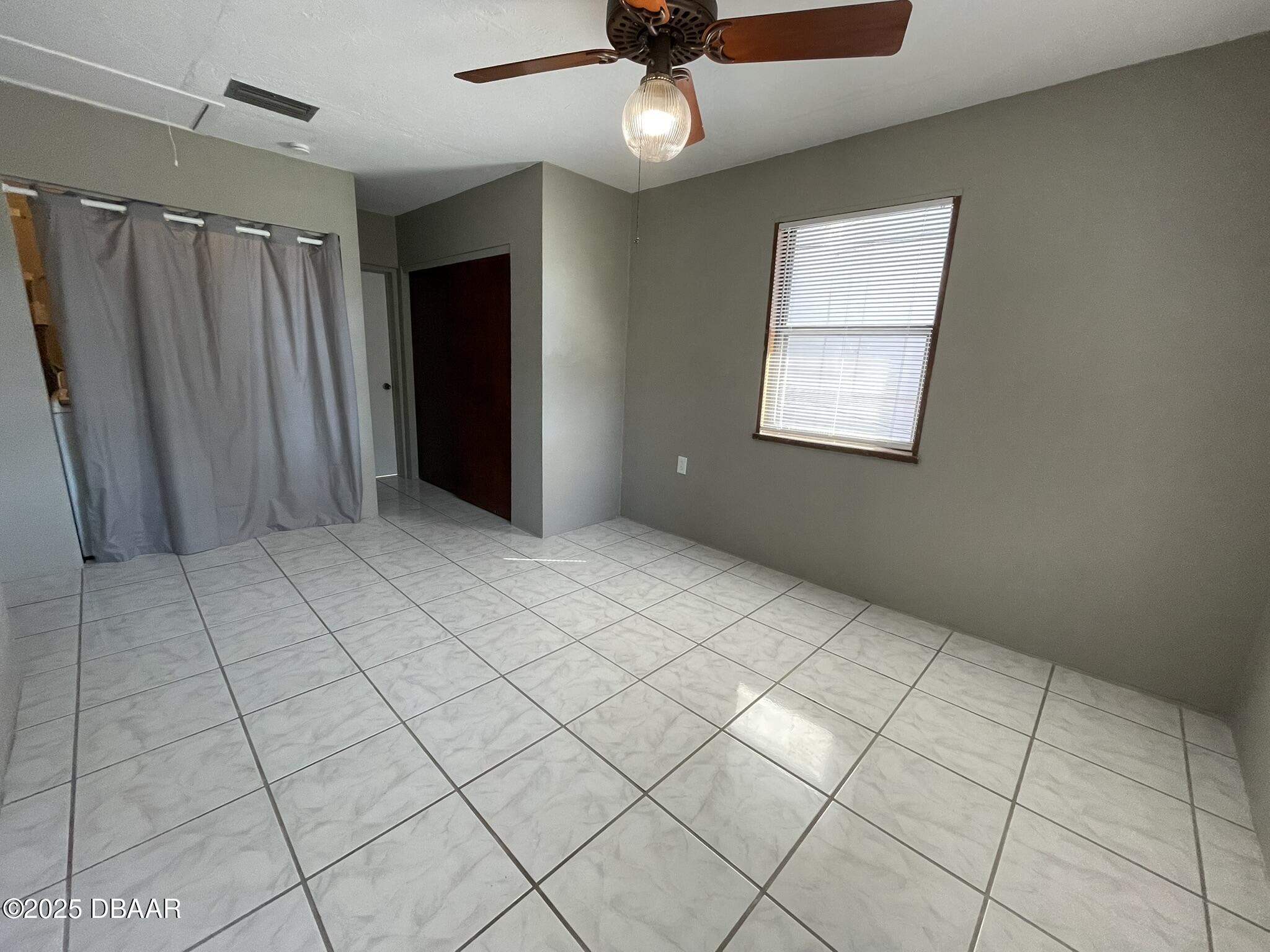 113 Fox Place Port Orange, FL 32127 - Photo 16 of 40 an empty room with windows