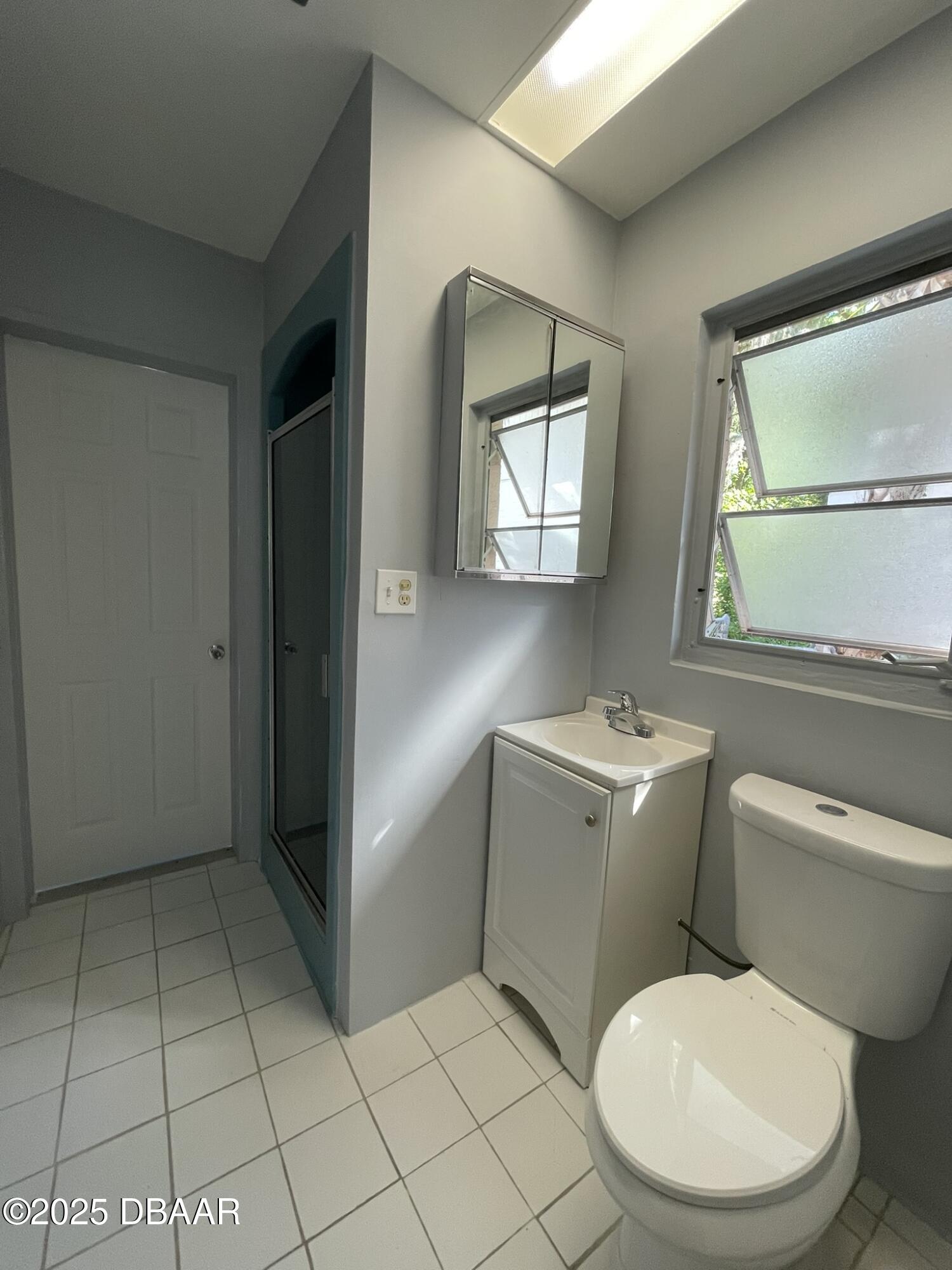 113 Fox Place Port Orange, FL 32127 - Photo 18 of 40 a bathroom with a toilet sink and mirror
