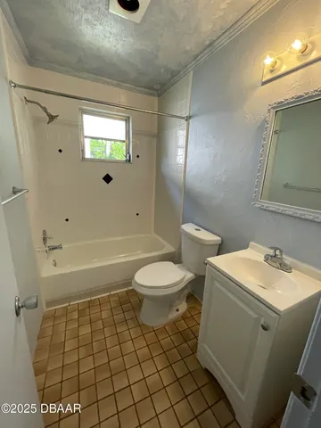 a bathroom with a toilet a sink and shower