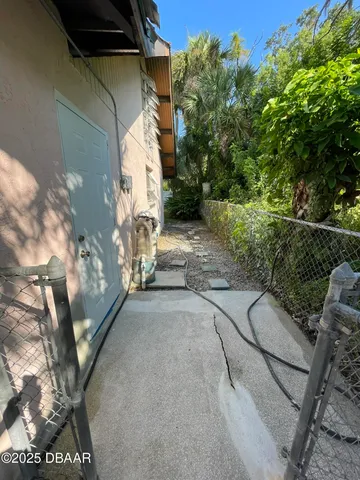 a view of a swimming pool with an outdoor seating and a yard