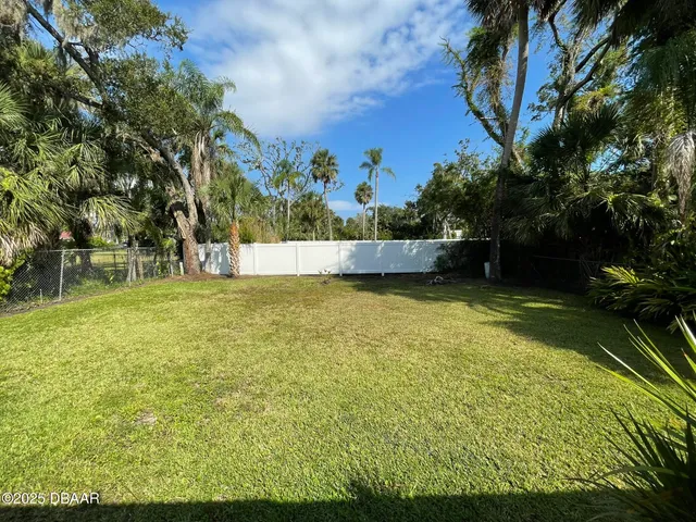 a view of a lake with a yard
