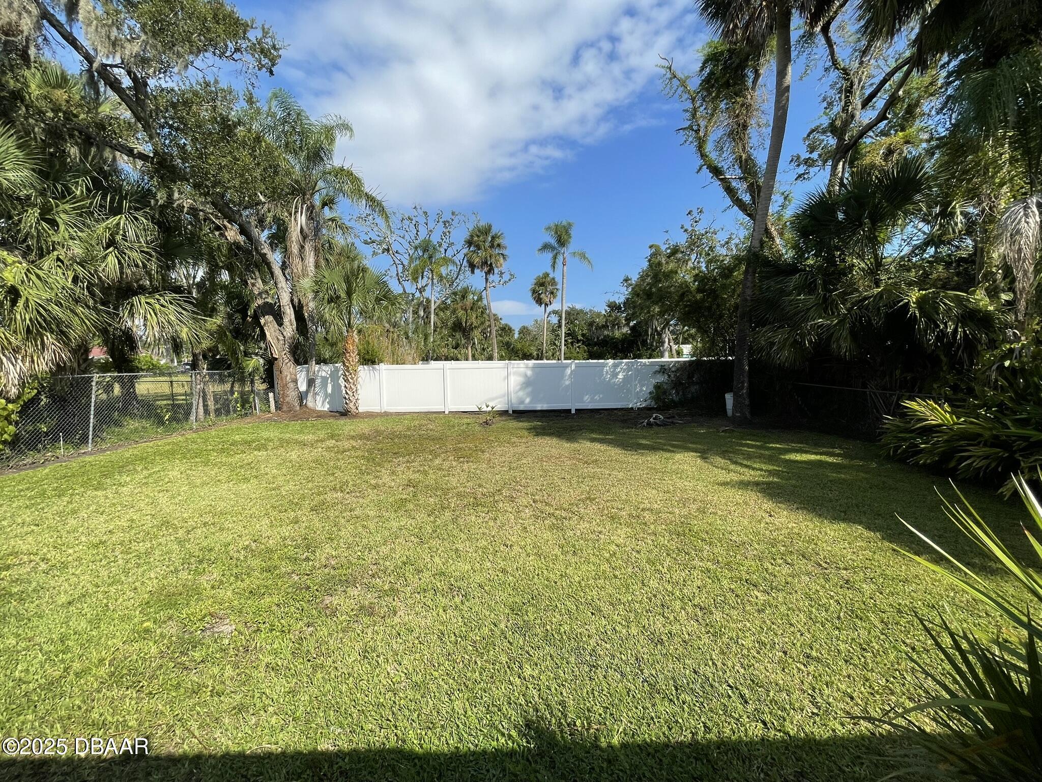 113 Fox Place Port Orange, FL 32127 - Photo 38 of 40 a view of a swimming pool with an outdoor seating and a yard