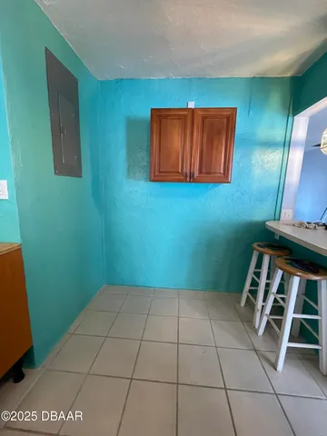 a view of a room with furniture and wooden floor