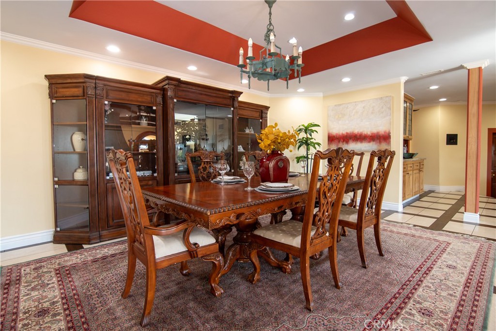 10425 Melvin Avenue Porter Ranch, CA 91326 - Photo 18 of 61 a view of a dining room with furniture