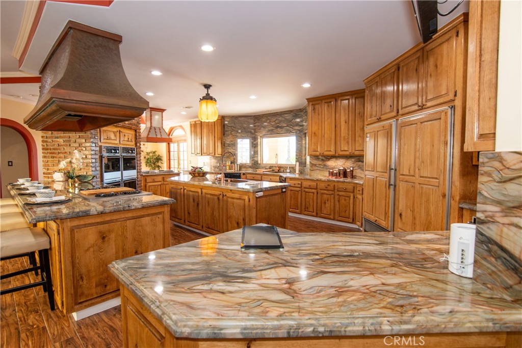 10425 Melvin Avenue Porter Ranch, CA 91326 - Photo 25 of 61 a kitchen with sink cabinets and appliances