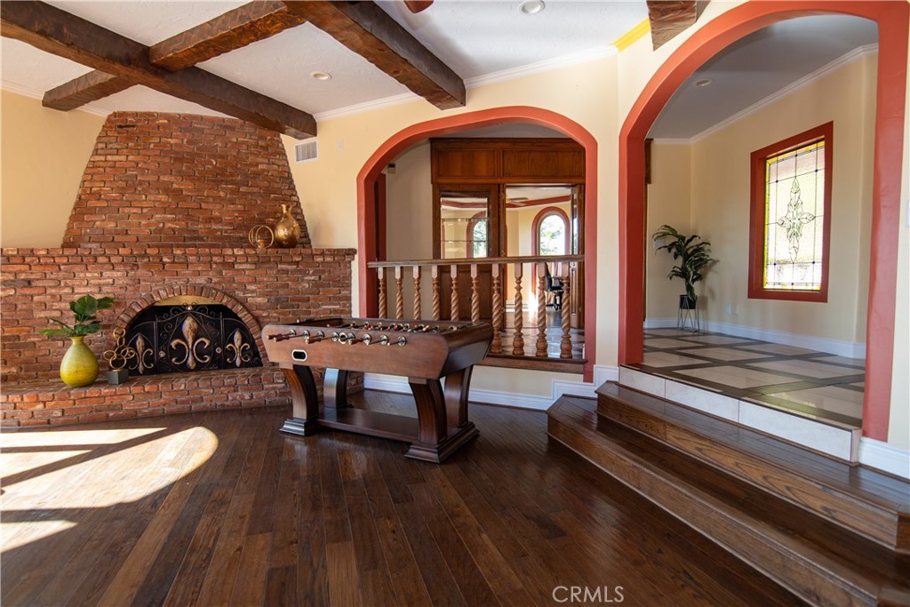 10425 Melvin Avenue Porter Ranch, CA 91326 - Photo 5 of 61 a living room with furniture fireplace and wooden floor