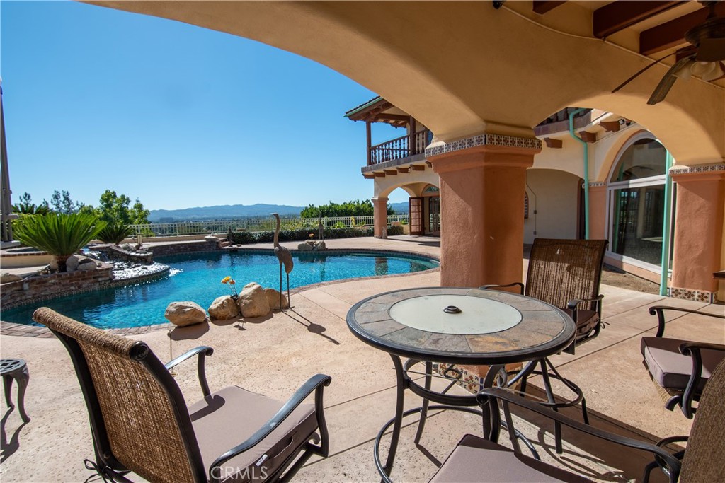 10425 Melvin Avenue Porter Ranch, CA 91326 - Photo 51 of 61 a view of a swimming pool with outdoor seating